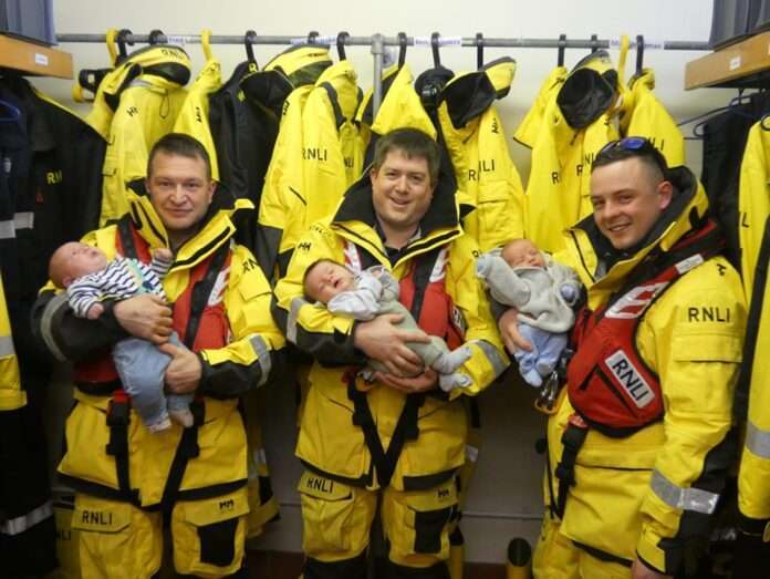 Before the crew meeting sunday morning at Eastbourne Lifeboat RNLI they had three visitors to the station. In just over a month three of the volunteer crew and their families welcomed new additions. From left to right, Mick and Hunter, Alex and Arthur, Brandon and Frankie.
