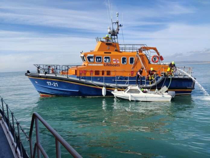 Newhaven and Eastbourne lifeboats, aided by Coastguard Helicopter 163, conduct a successful rescue operation