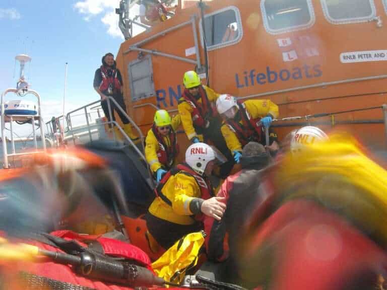 Three Safe After Boat Sinks in Choppy Waters Off Worthing Coast