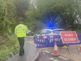 Man found dead with gunshot wound at scene of A286 car crash in Sussex