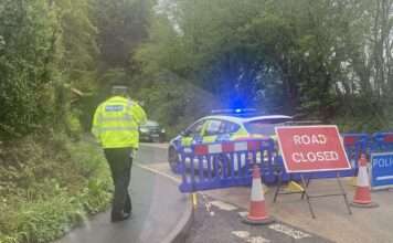 Man found dead with gunshot wound at scene of A286 car crash in Sussex
