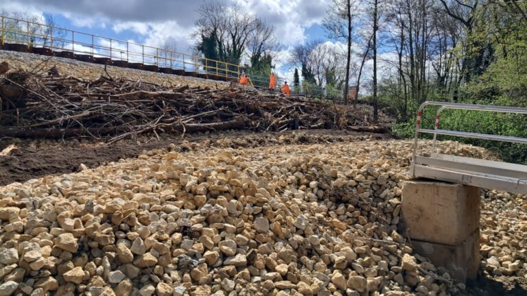 Network Rail stabilises embankment with 30-metre wall and community support efforts after January landslip