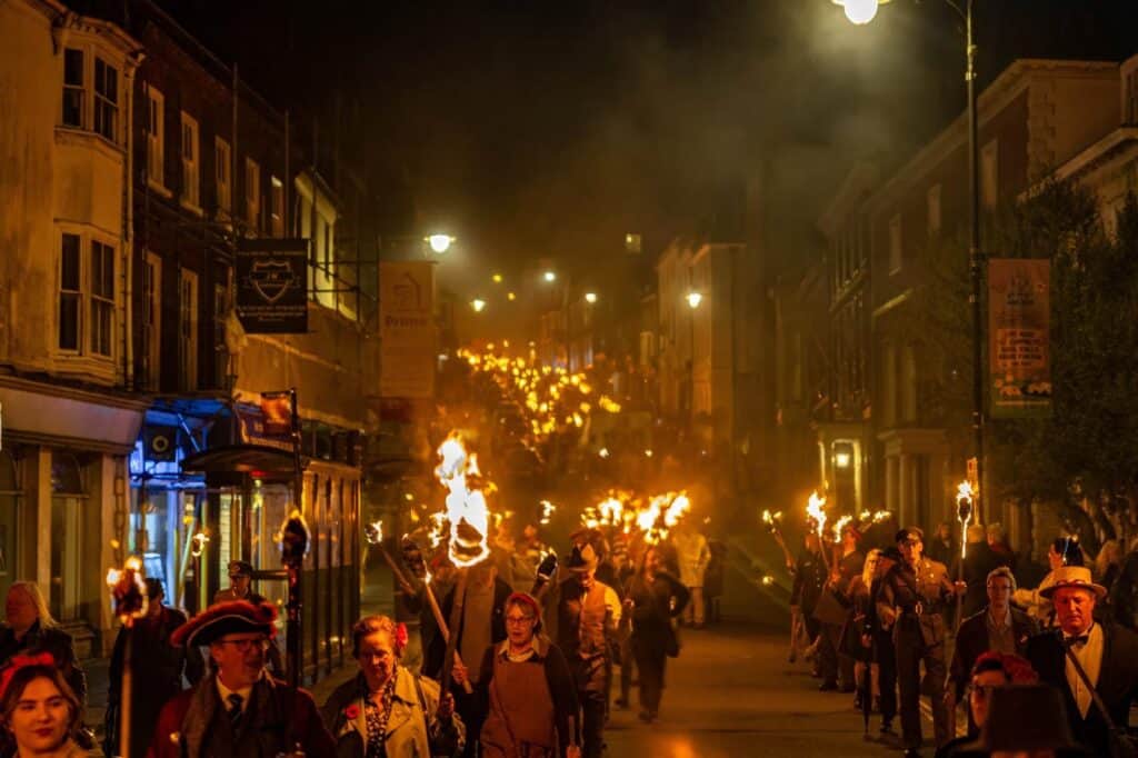 Lewes Bonfire Societies Unite for Historic VE Day Torchlit Procession