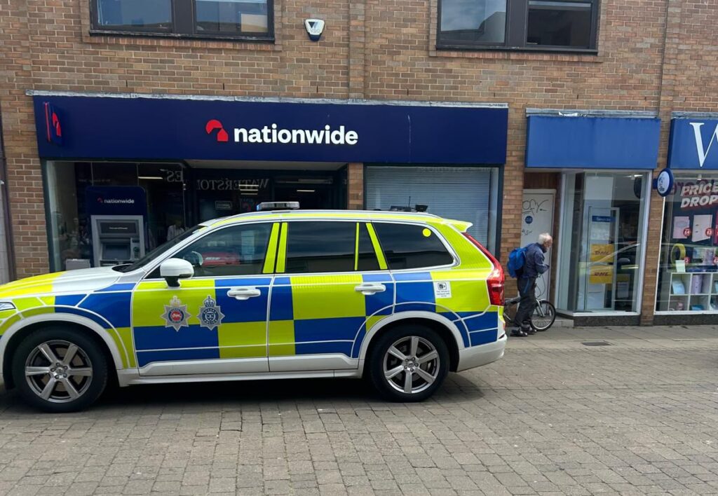 Crowd Cheers as Armed Suspect Detained Outside Hove Bank 1 Armed Man Arrested Outside Hove Nationwide