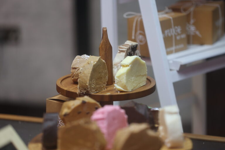 Assorted fudges on a wooden platter